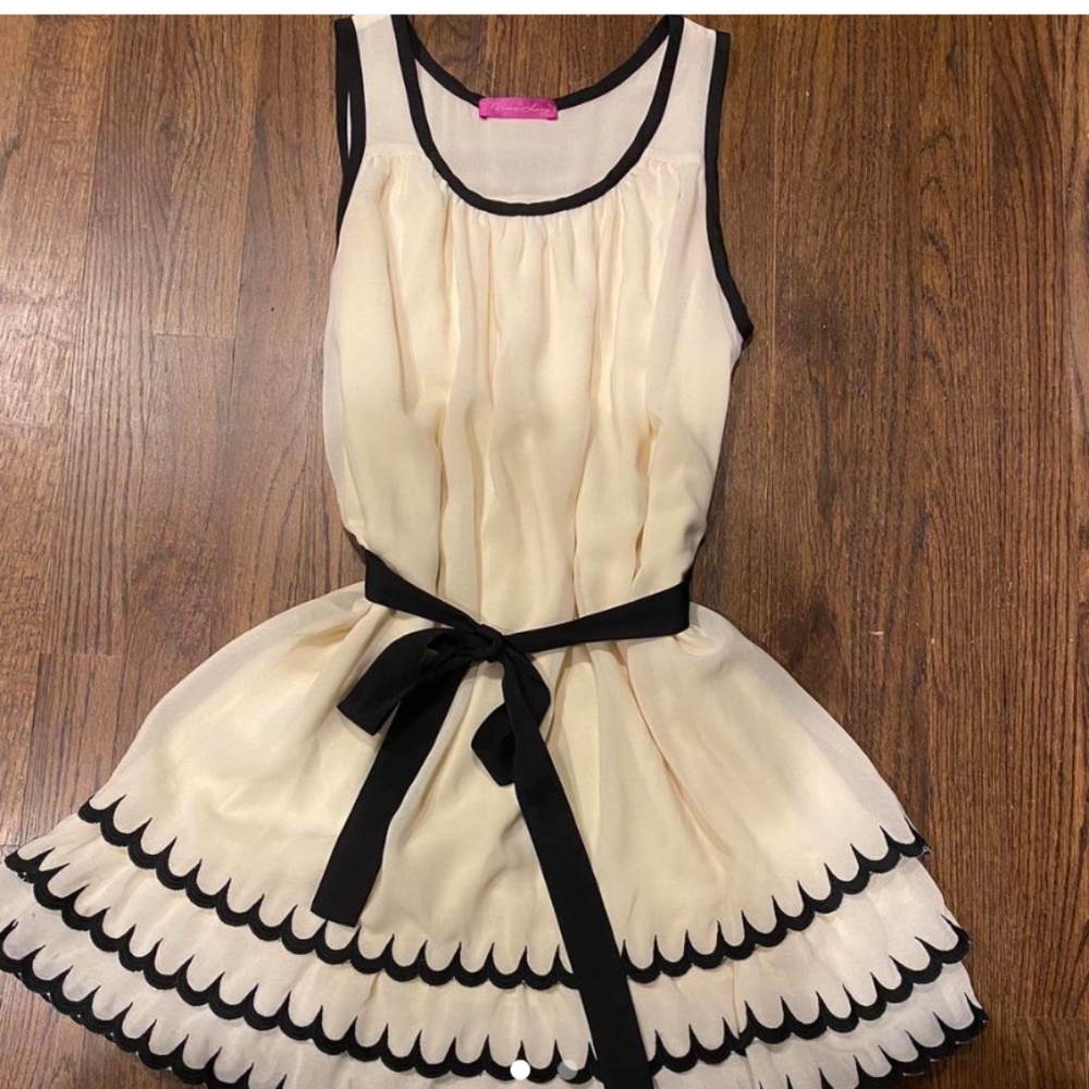 Narcisco Lang off white  and black frilly designer dress